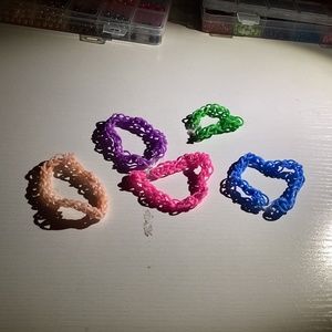 Pink, Purple, Blue, Green, and Nude colored bracelets ( 5 )